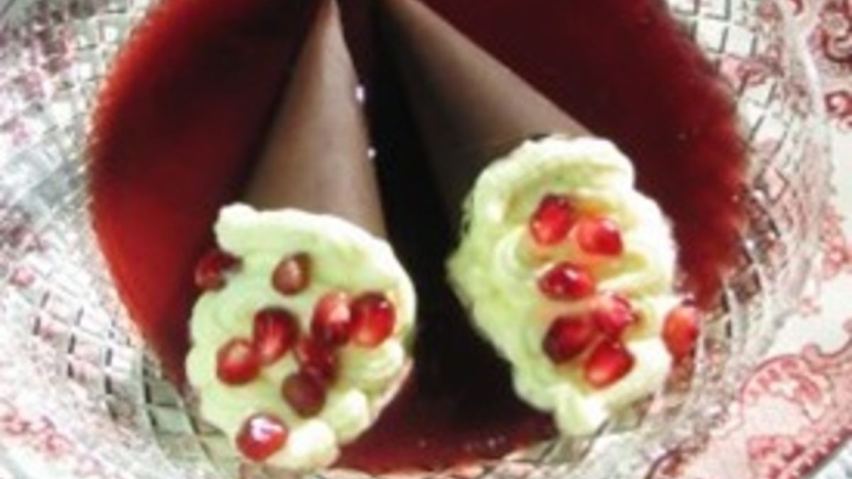 Bittersweet Chocolate Cones Filled With White Chocolate Mousse, Floating On Pomegranate Sauce