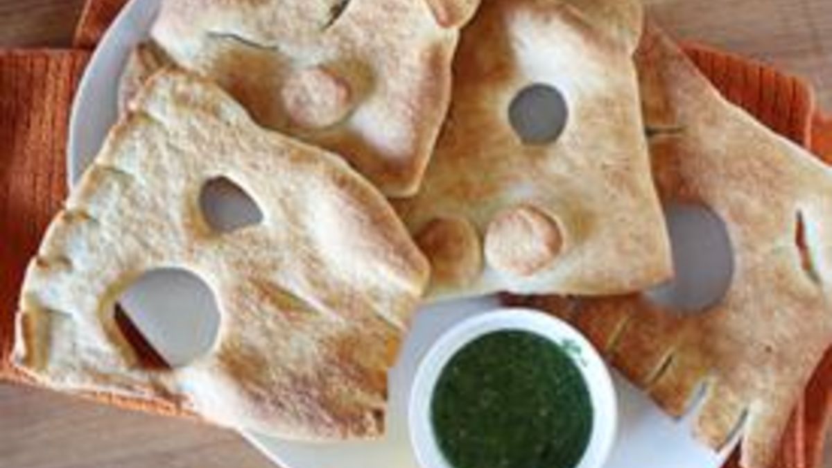 Ghoul Face Flatbreads with Goblin-Green Dipping Sauce