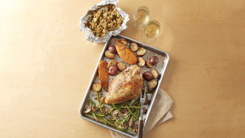 Roasted Turkey breast, sweet potatoes, red potatoes, green beans and mushrooms on a sheet pan and stuffing in a foil pouch 