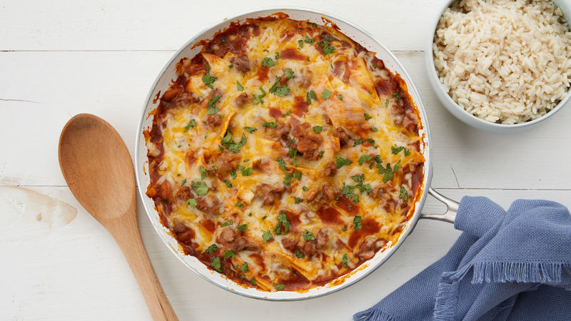 20-Minute Smothered Beef Burrito Skillet prepared recipe and side bowl of rice