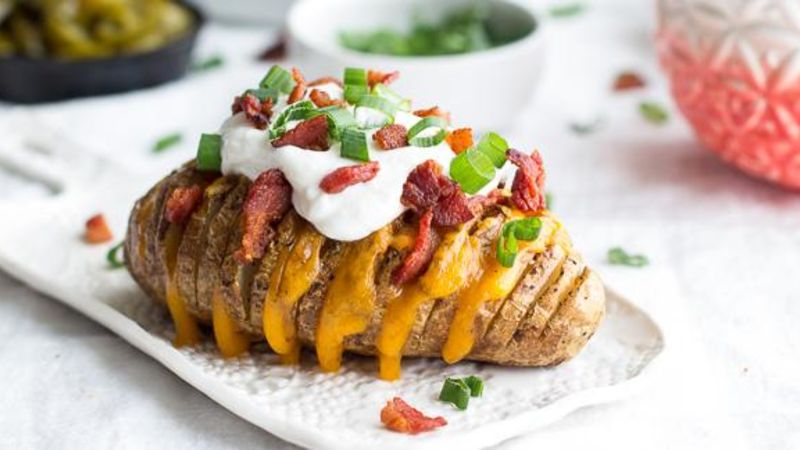 Loaded Hasselback Potatoes Recipe - Tablespoon.com
